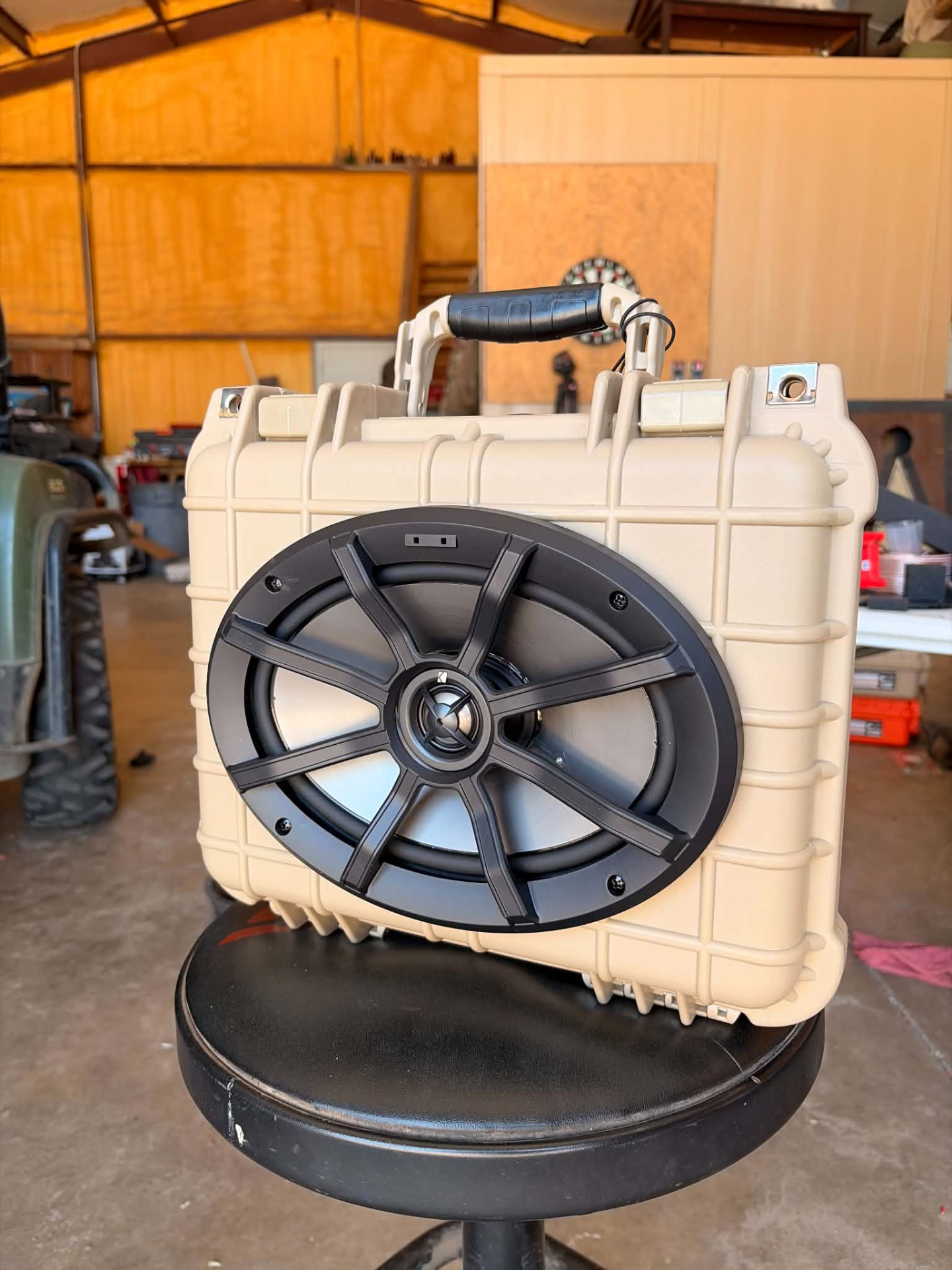 Tan rugged outdoor speaker box with black oval speaker in the shop