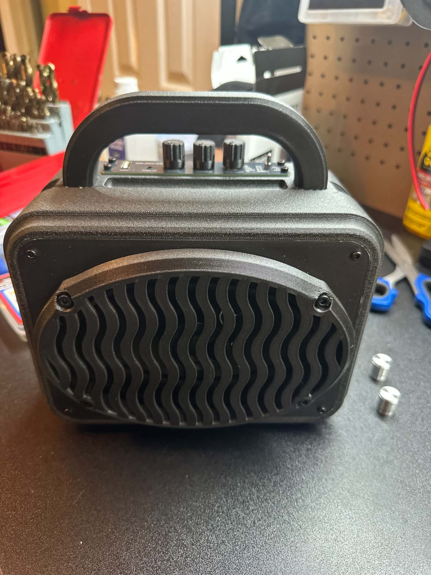 Black handmade custom speaker box with wave grille and top control panel